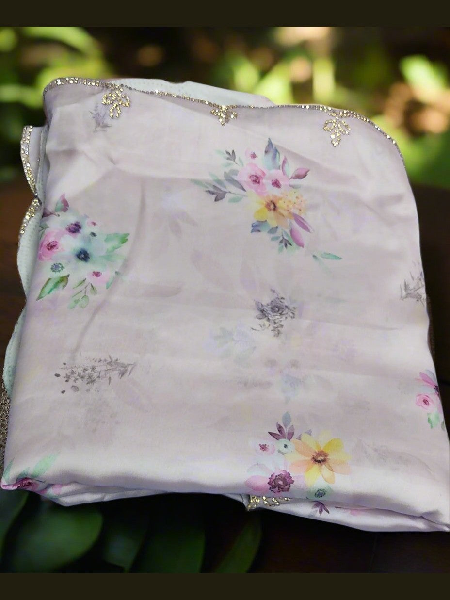 Amethyst haze purple floral saree with a shimmering stone work border.