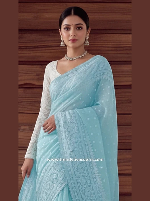 Celestial Cerulean organza silk saree with delicate floral necklace embroidery and sheer frosted finish.