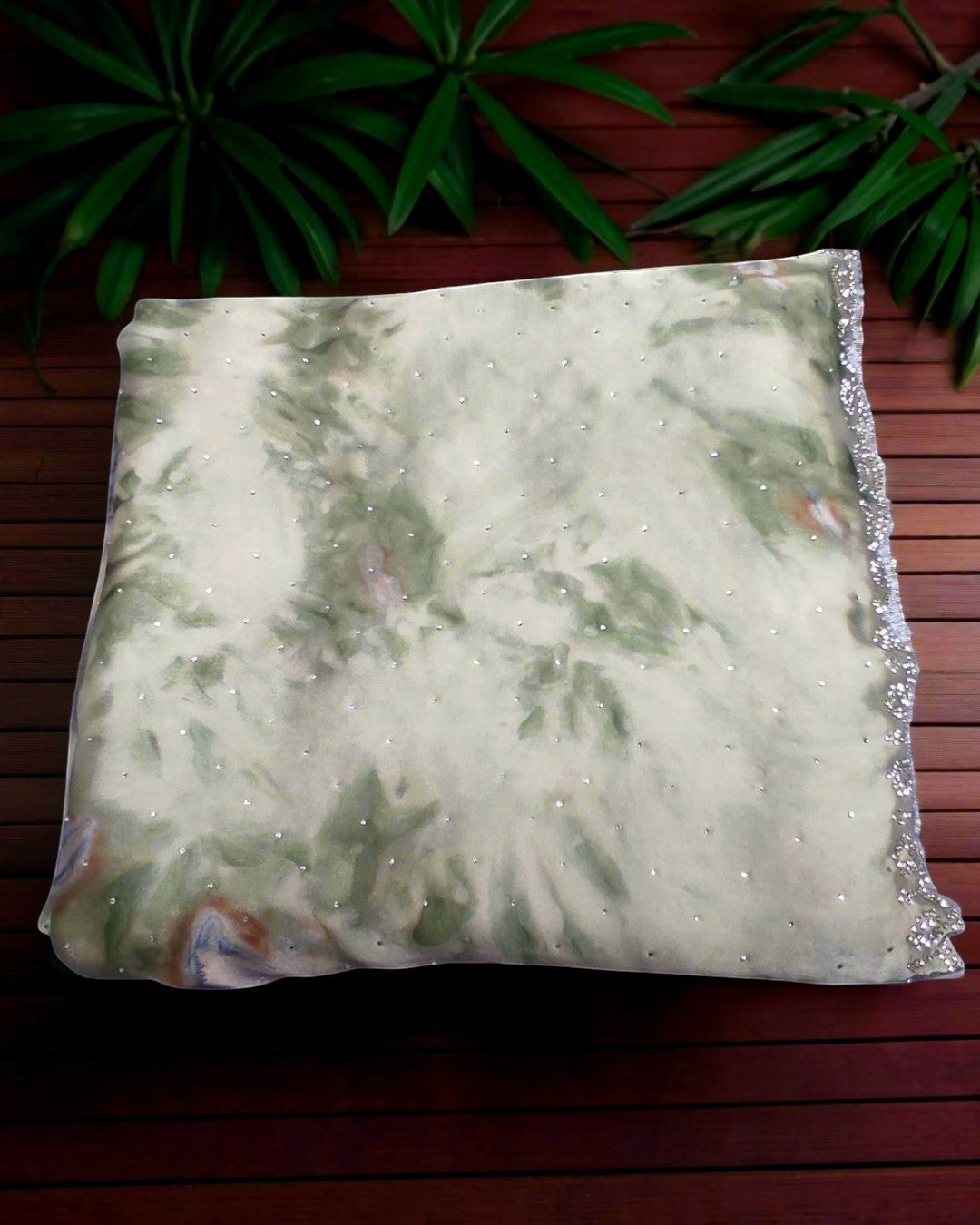 Ethereal sage green floral saree with scalloped stone border