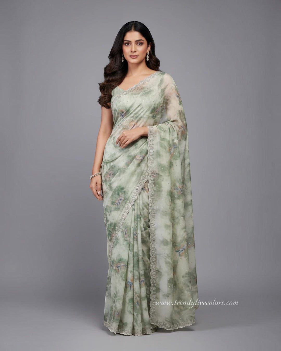 Ethereal sage green floral saree with scalloped stone border