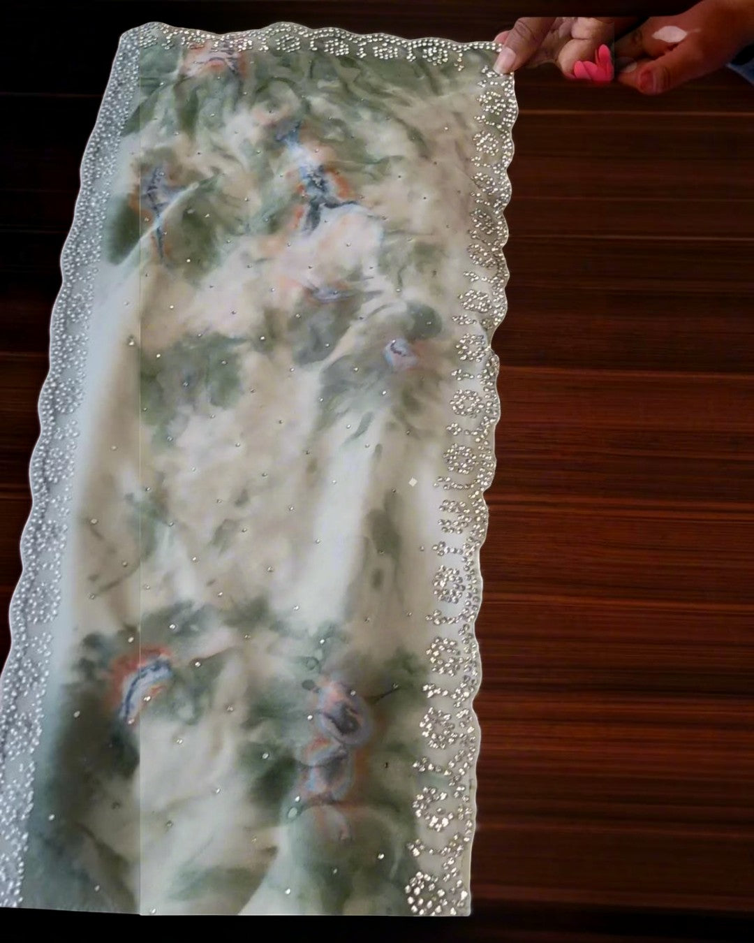 Ethereal sage green floral saree with scalloped stone border